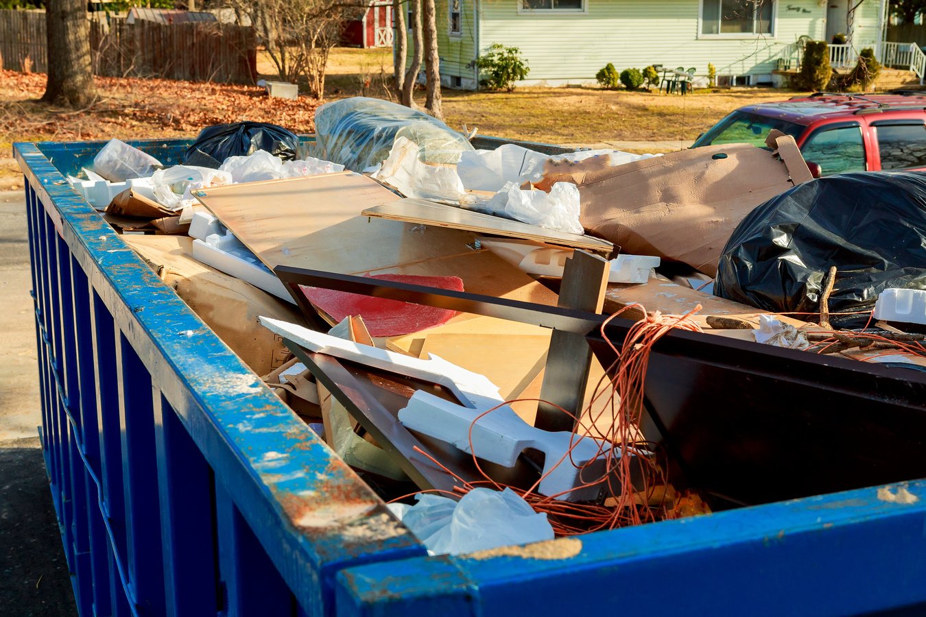 Over Flowing Dumpsters Being Full with Garbage